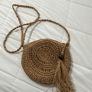 Straw cross body bag. 10” x 9”.  Zippered top.  Used once.